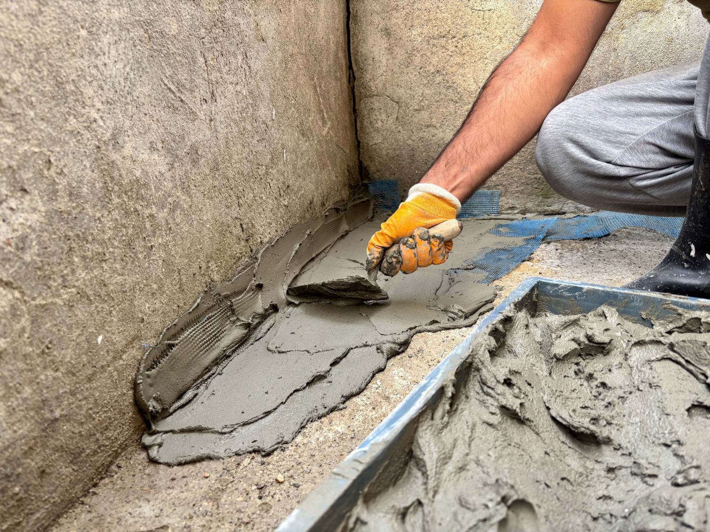 water intrusion solutions Waterproofing repair around a basement hatchway to help prevent water intrusion