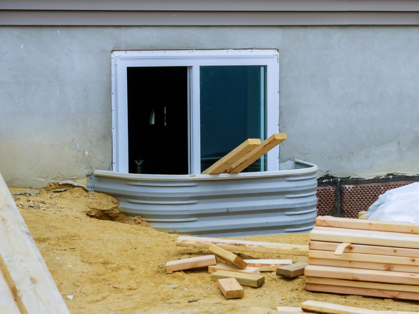 Old Basement Window Removal & Replacement (2) Contractors installing a new basement bulkhead on a Western Massachusetts home